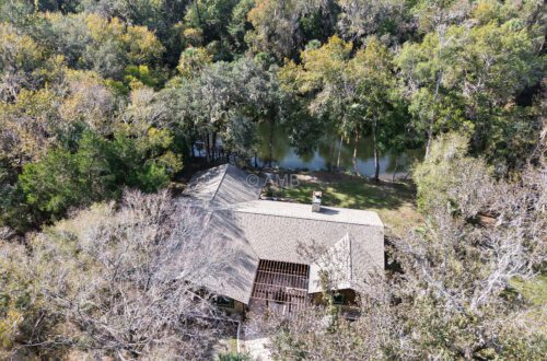 Aerial photo of waterfront home on the Withlacoochee River for sale in Inglis, Florida.