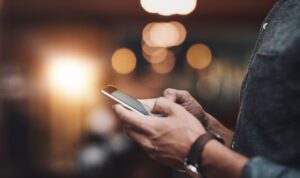 Man dialing cell phone